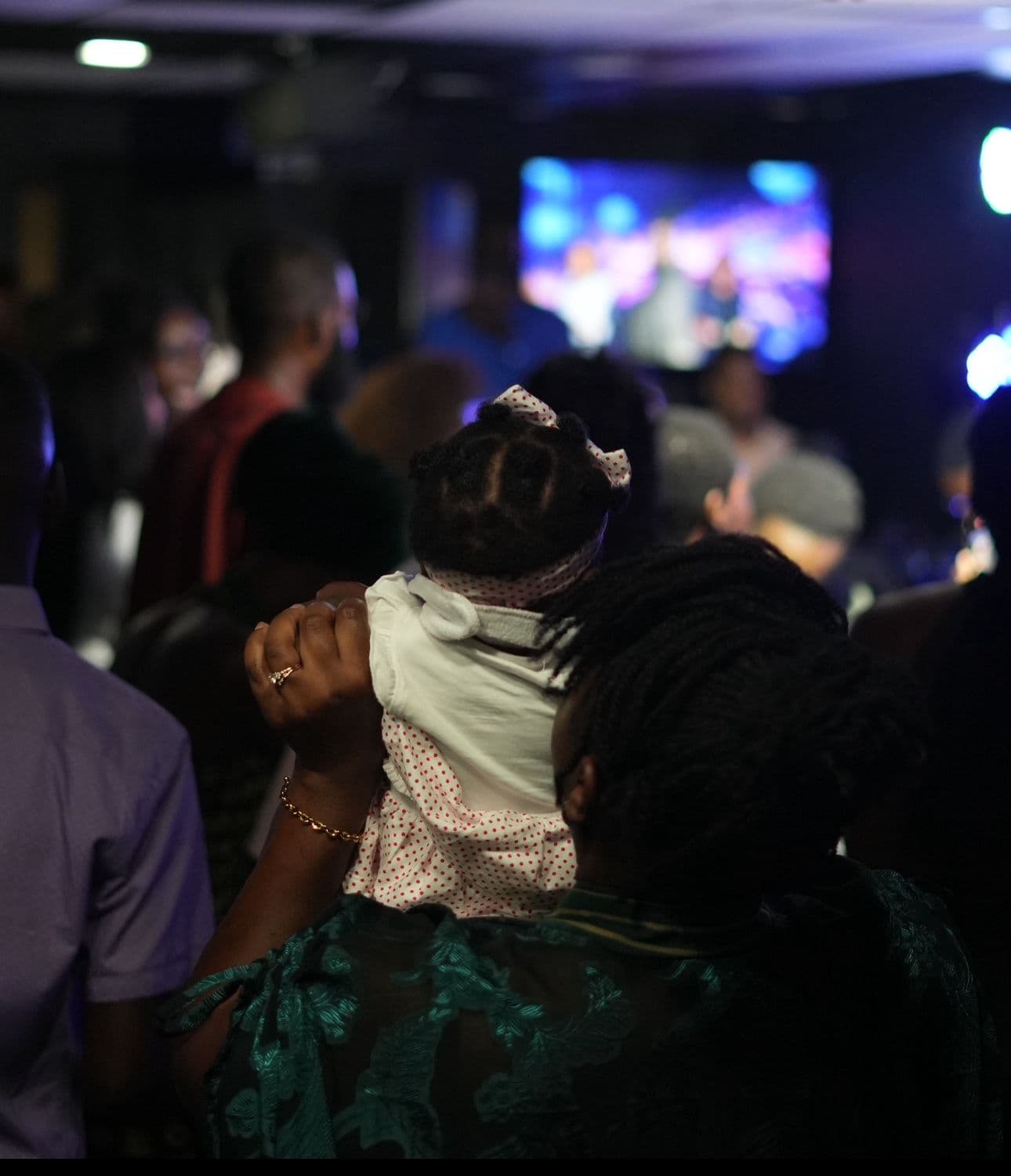 Church worship with raised hands